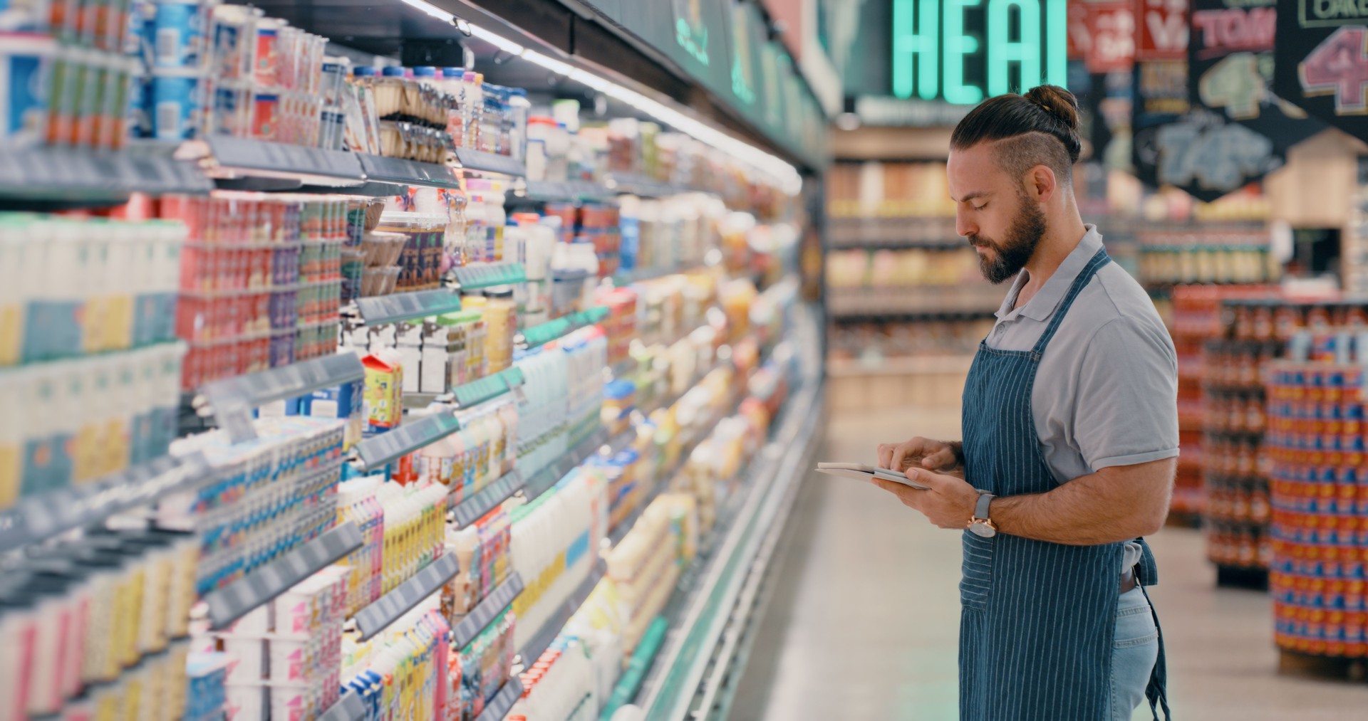 Digital tablet, supermarket or employee on pricing app, checklist count idea or product stock management. Man, worker or grocery shopping technology of food logistics, sale deal thinking or inflation